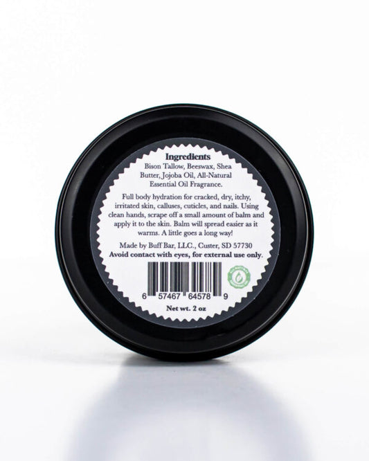 Buff Bar All-natural beard balm in a black glass with black lid and label featuring the Spice Barrell fragrance and the Buff Bar Bison illustration. The balm is on a white background.