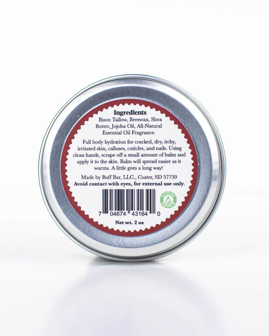 Buff Bar All-natural body balm in a tin and label featuring the Apple Moonshine fragrance and the Buff Bar Bison illustration. The tin is on a white background.
