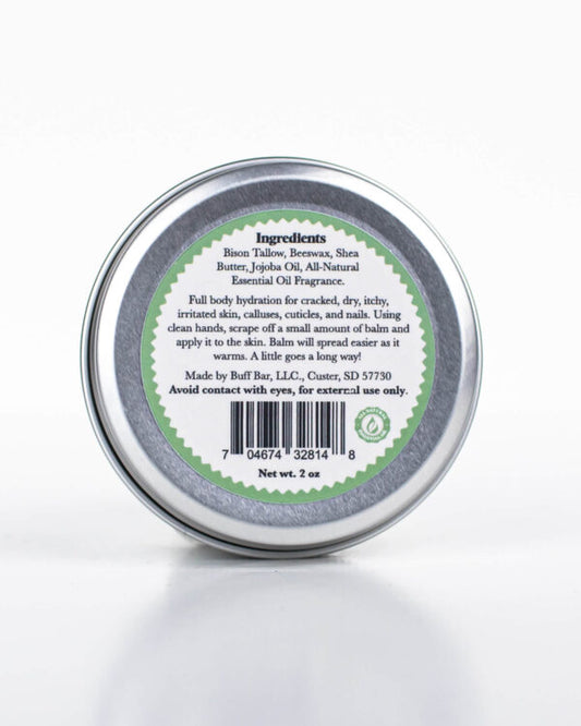 Buff Bar All-natural body balm in a tin and label featuring the Ponderosa Pine fragrance and the Buff Bar Bison illustration. The tin is on a white background.
