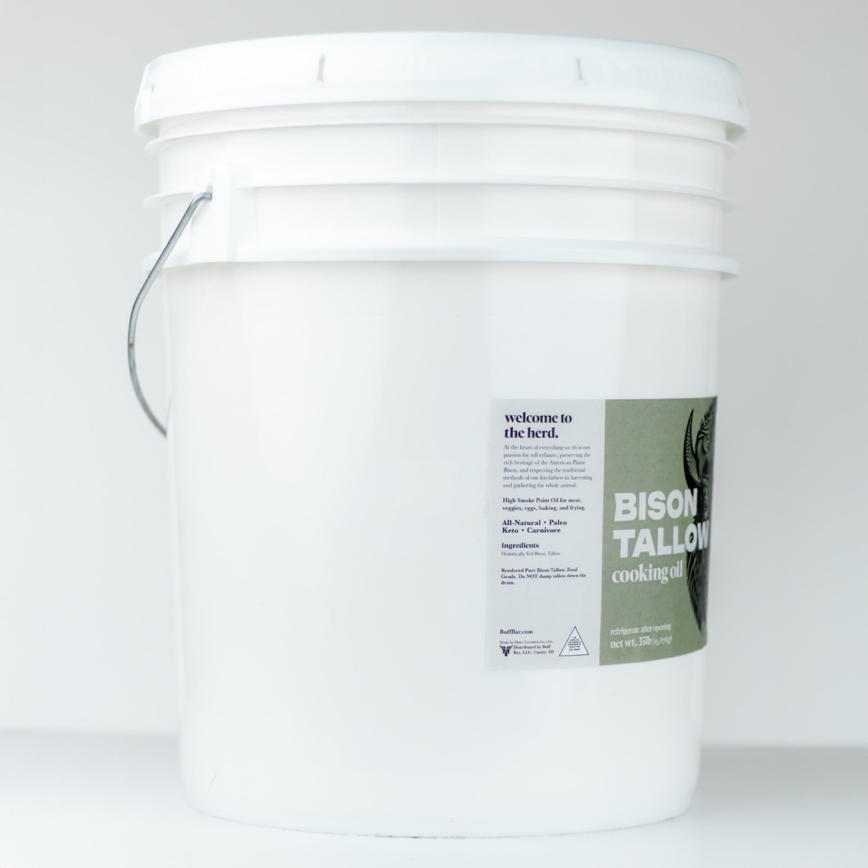 White 5 gallon bucket of bison tallow cooking oil with a label on a white background