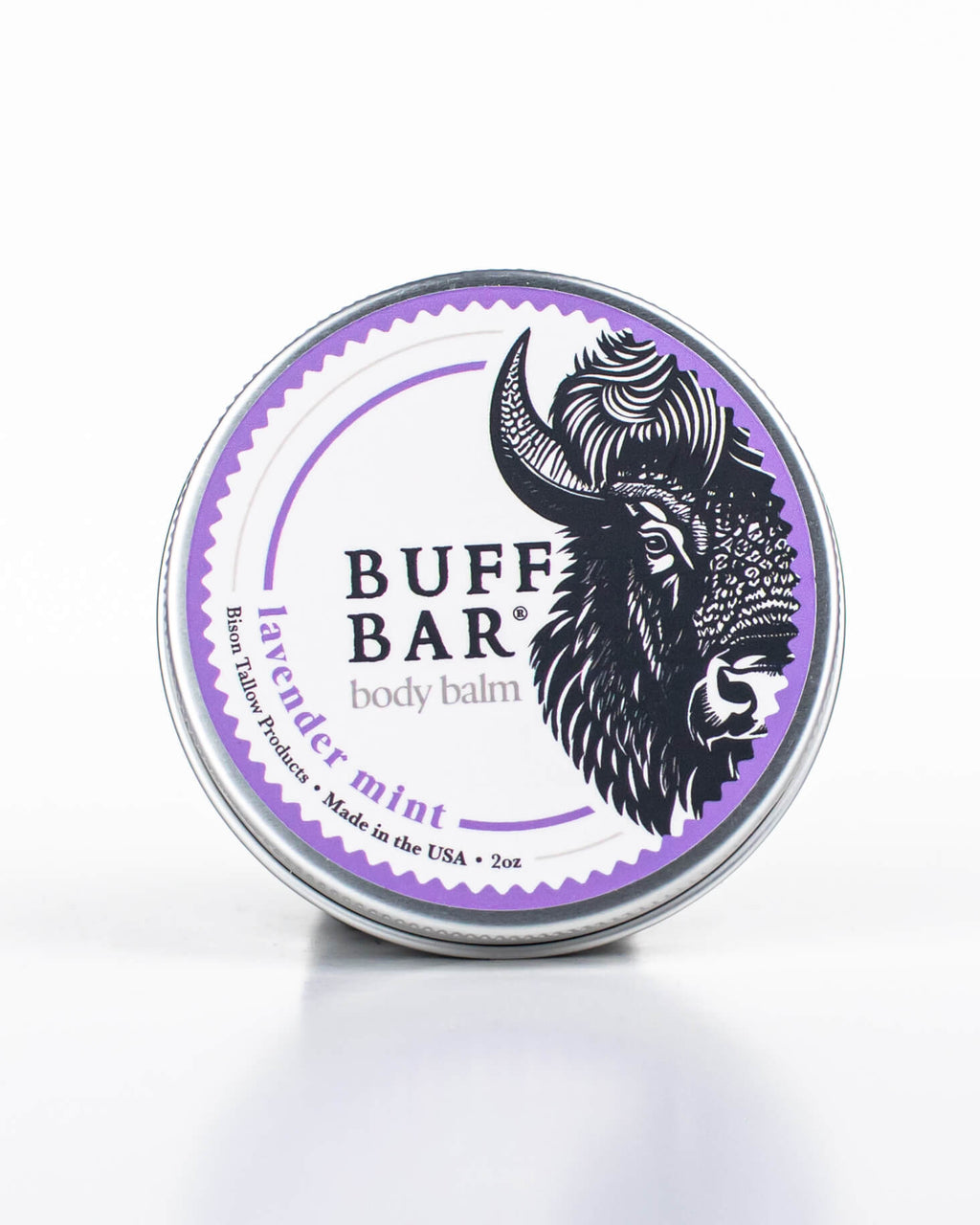 Buff Bar All-natural body balm in a tin and label featuring the Lavender Mint fragrance and the Buff Bar Bison illustration. The tin is on a white background.
