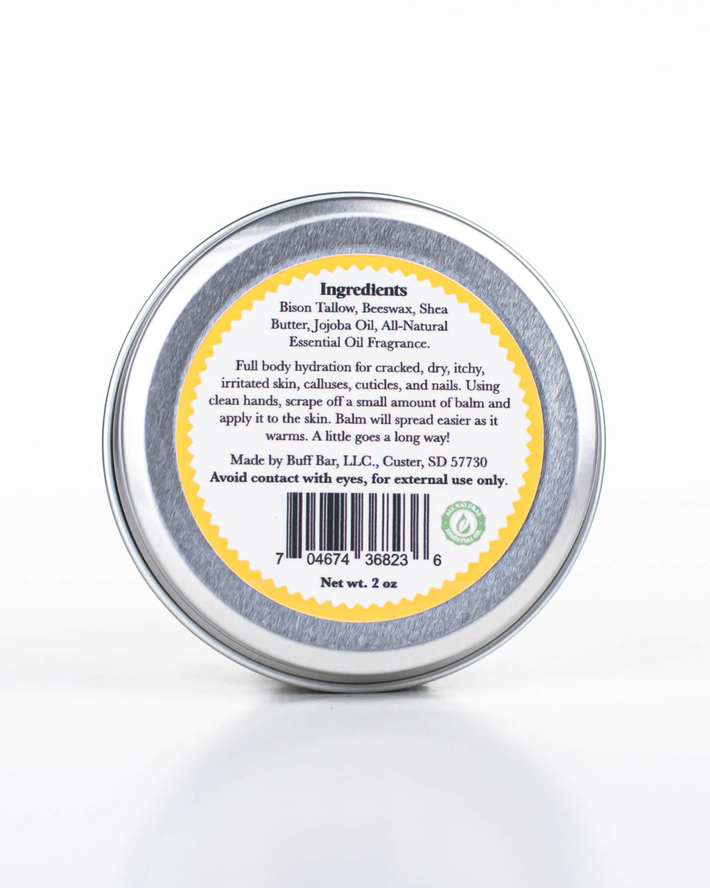 Buff Bar All-natural body balm in a tin and label featuring the Lemon Drop fragrance and the Buff Bar Bison illustration. The tin is on a white background.