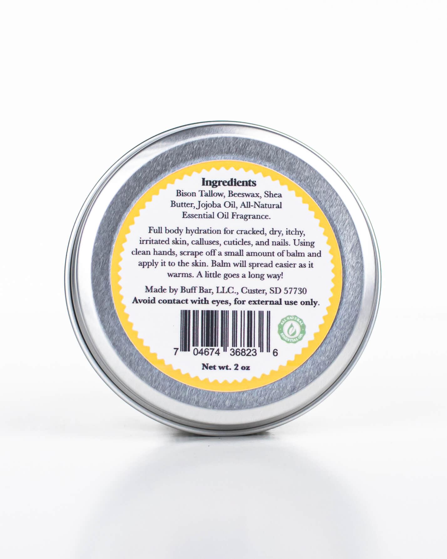 Buff Bar All-natural body balm in a tin and label featuring the Lemon Drop fragrance and the Buff Bar Bison illustration. The tin is on a white background.