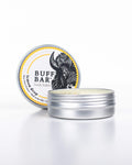 Buff Bar All-natural body balm in a tin and label featuring the Lemon Drop fragrance and the Buff Bar Bison illustration. The tin is on a white background.