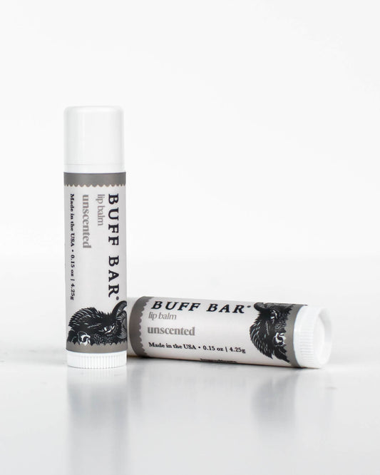 Two tubes of Buff Bar All-Natural lip balm featuring the Unscented Fragrance on a white background.