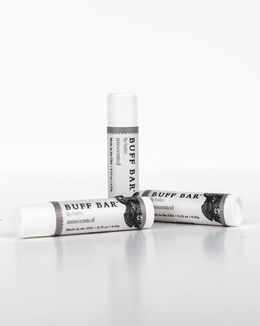 Three tubes of Buff Bar All-Natural lip balm featuring the Unscented Fragrance on a white background.