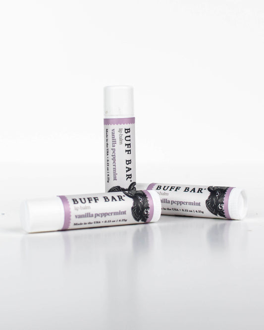 Three tubes of Buff Bar All-Natural lip balm featuring the Vanilla Peppermint Fragrance on a white background.