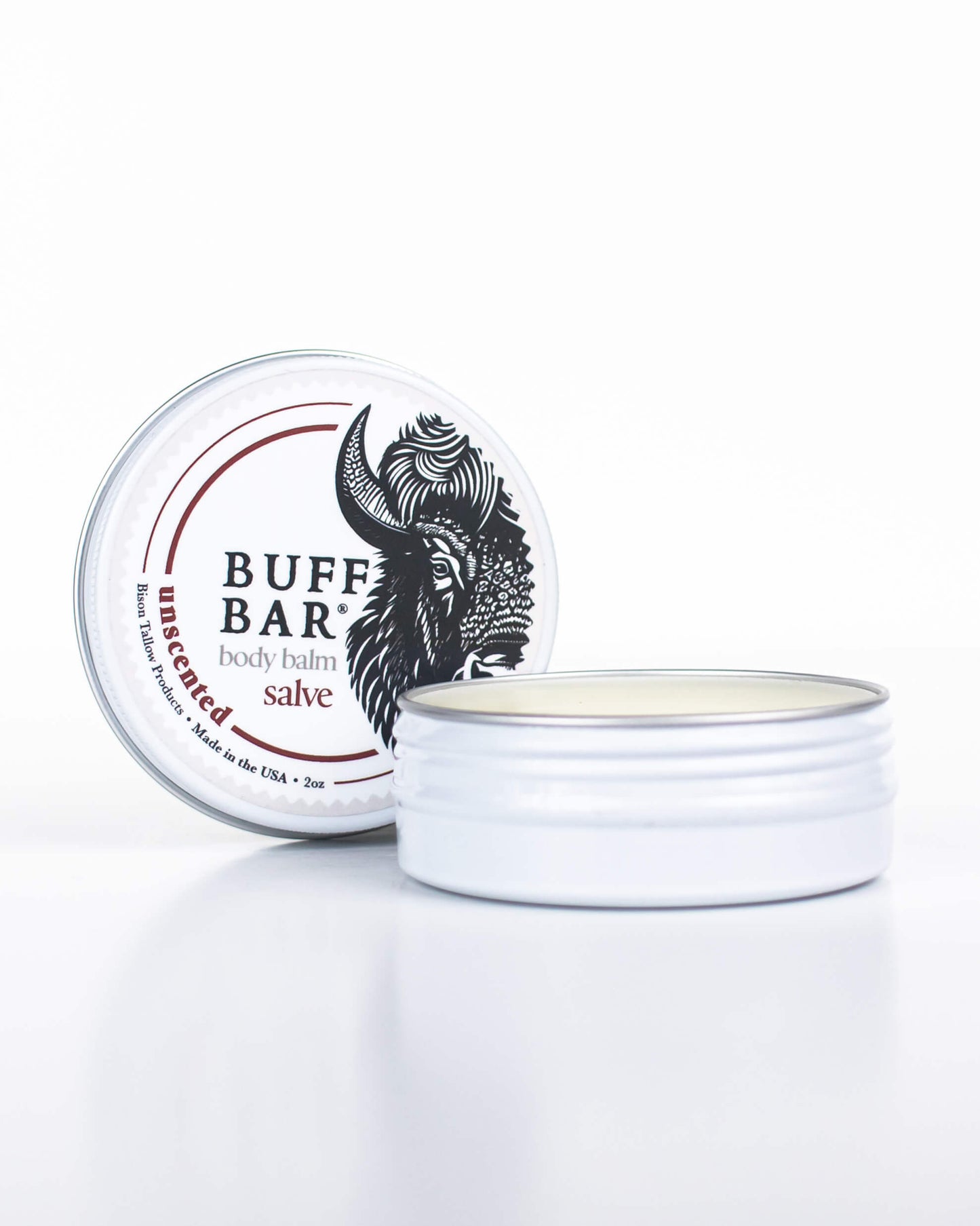 Buff Bar All-natural body balm in a tin and label featuring the Unscented fragrance and the Buff Bar Bison illustration. The tin is on a white background.